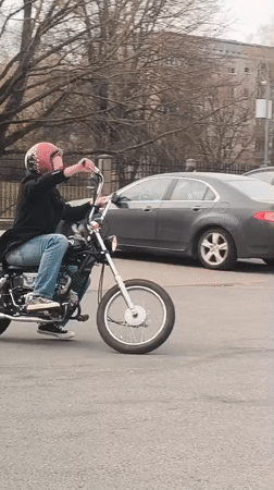 Afternoon moments captured in Riga: motorcyclist and car selfie