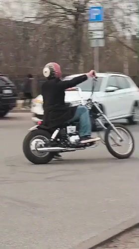 Afternoon moments captured in Riga: motorcyclist and car selfie