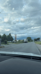 Mercedes drives past trucks and gas station in Blagoevgrad