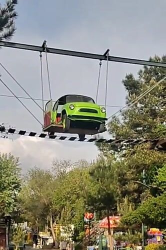 Suspended car installation spotted above park walkway in Anapa