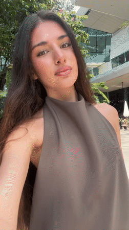 Woman films selfies near bronze statue in Aventura public space