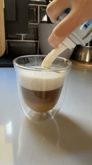 Coffee preparation with whipped cream observed in Barcelona