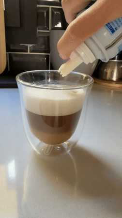 Coffee preparation with whipped cream observed in Barcelona