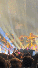 Live concert performance with singer and dancers draws crowd in Paris
