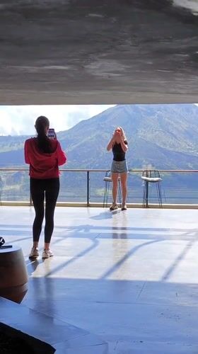Young women visit scenic mountaintop cafe in Kintamani, Indonesia