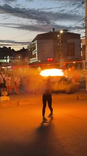 Fire performance draws a street crowd in Vityazevo at dusk