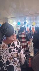 Indoor celebration with smiling faces and festive atmosphere