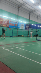 Woman's badminton session documented in Vietnam sports facility