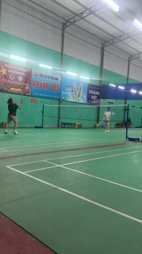 Woman's badminton session documented in Vietnam sports facility