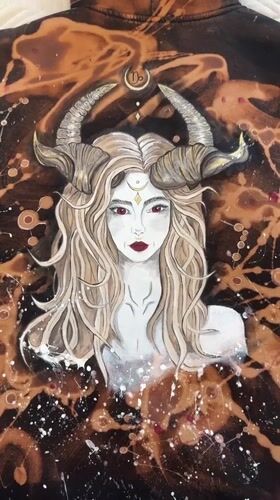 Horned woman artwork documented on fabric in Bobrovo