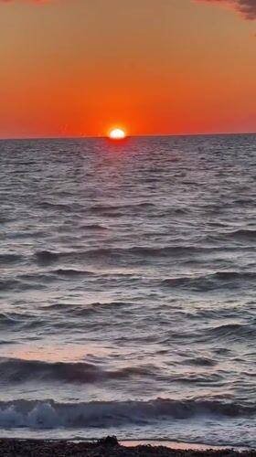 Baltic sunset, Gremersdorf beach, orange sky and calm sea