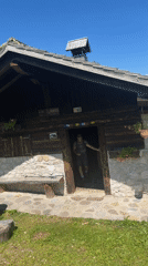 Leaving a mountain cabin in the Dolomites on a summer hike