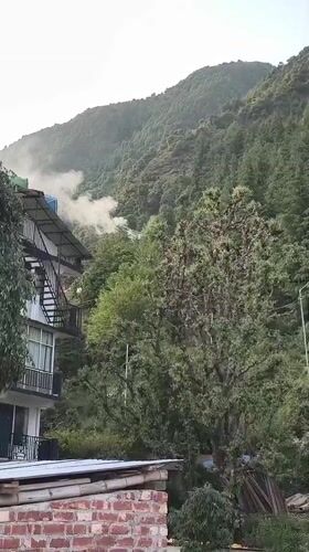 Building with metal staircase documented in Dharamkot, India