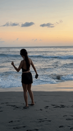 Women enjoy sunset beach activities in North Kuta, Indonesia