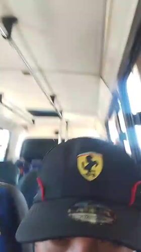 Ferrari cap wearer filmed inside blue-seated van in Porlamar