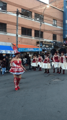 Colorful carnival parade moves through the streets of La Paz