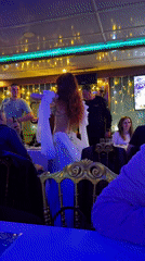 Belly dancer performs for diners on Turkey dinner cruise
