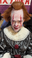 Pennywise cosplayer photographed with psychiatric hospital poster in Saratov