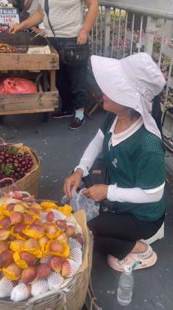 Morning street vending and foot traffic under a Baiyun District overpass