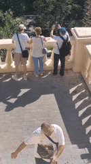 Tourists sightsee while construction continues in Sochi, Russia
