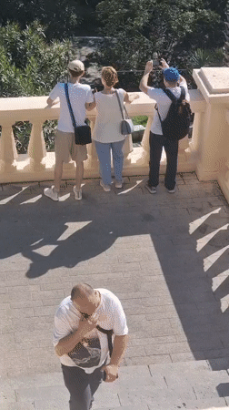 Tourists sightsee while construction continues in Sochi, Russia