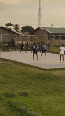 Pickup volleyball on a concrete court in Narayi, Nigeria