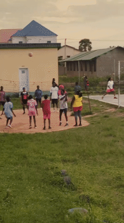 Pickup volleyball on a concrete court in Narayi, Nigeria