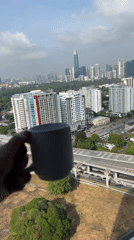 Morning Coffee Ritual Documented Against Kuala Lumpur Skyline
