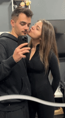 Couple takes mirror selfies in Sofia indoor location