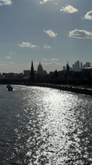 Tourist captures Moscow landmarks during sunny afternoon walkabout