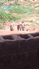 Women working near fields and construction site in Bukuru