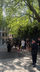 Film crew shoots overhead walking scene in central London
