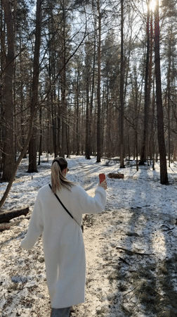Couple spends afternoon walking through snowy forest in Reutov