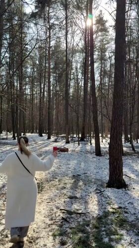 Couple spends afternoon walking through snowy forest in Reutov