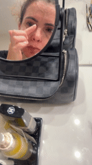 Woman performs evening skincare routine in Vila Nova de Gaia