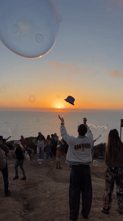 Sunset dance party draws crowds to San Diego oceanfront cliffs