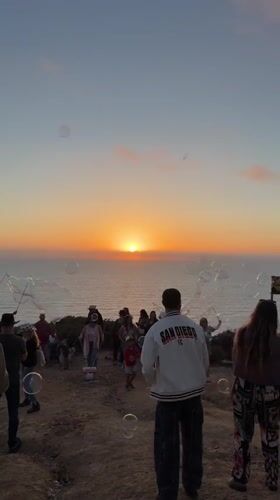 Sunset dance party draws crowds to San Diego oceanfront cliffs
