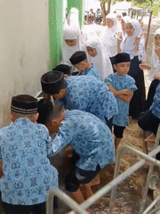 Boys perform ritual ablution at school in Lhokseumawe