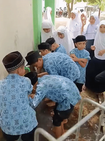 Boys perform ritual ablution at school in Lhokseumawe