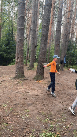 Kids run an outdoor course in a Chaikovsky forest