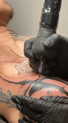 Man Gets Chest Tattoo in Moscow Studio