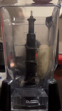 Late-night smoothie preparation captured in Mexican kitchen