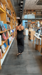 Woman with tattoos spotted browsing Bangkok bookstore early morning