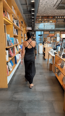 Woman with tattoos spotted browsing Bangkok bookstore early morning