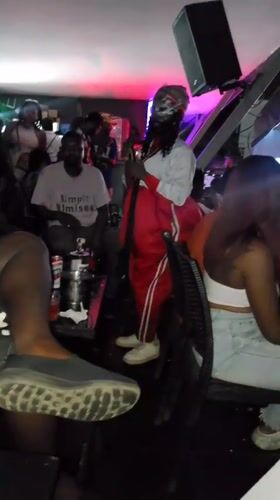 Nightclub gathering with rapper, masked performer documented in Nigeria