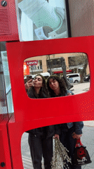 Women pose for selfie with vintage TV in Yerevan