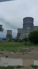 Workers inspect industrial pipelines at Taraz power facility