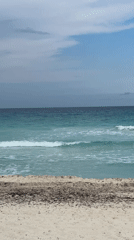 Beach scene recorded in Cancún showing turquoise waters
