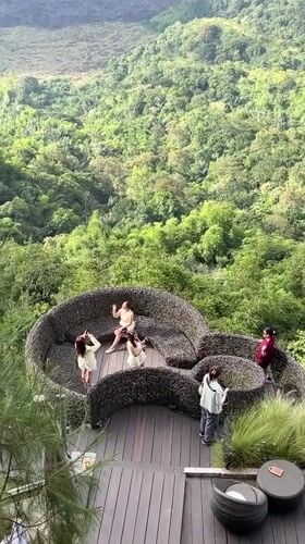 Tourists visit nest-structure viewpoint attraction in Kintamani, Indonesia