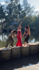 Women cross water on stepping stones in Đà Nẵng